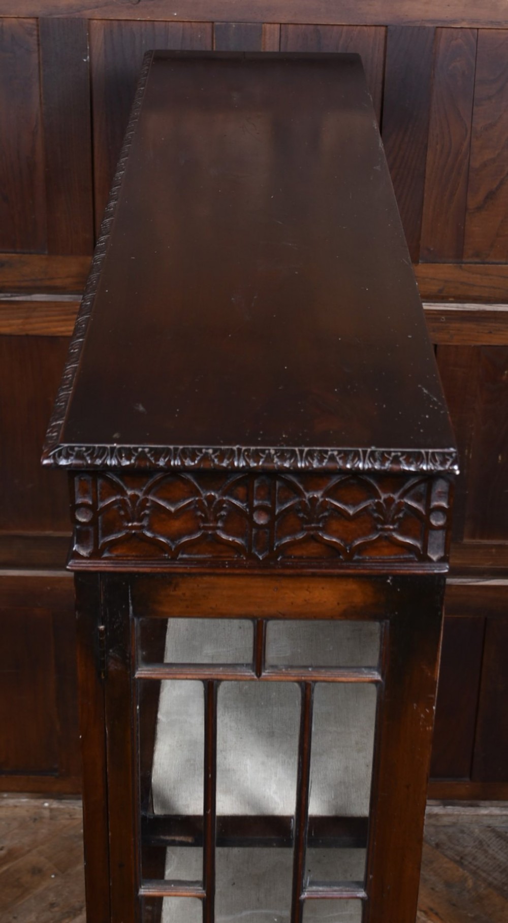 A dark mahogany Chippendale Revival display cabinet featuring double glazed doors with diamond astragal glazing, blind fretwork frieze, and cabriole legs on ball and claw feet. View XIV