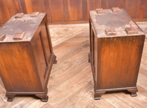 An Edwardian walnut pedestal desk featuring nine drawers with brass swan-neck handles, panelled sides, and bracket feet. View XI