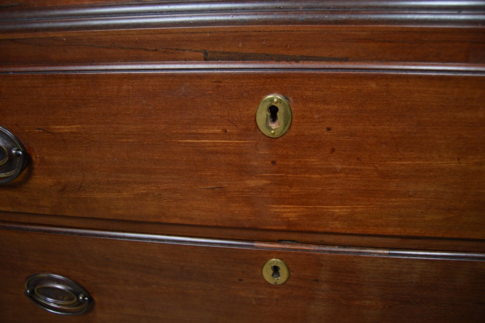 A Georgian mahogany chest-on-chest featuring two stacked drawer units with brass handles and bracket feet. View II