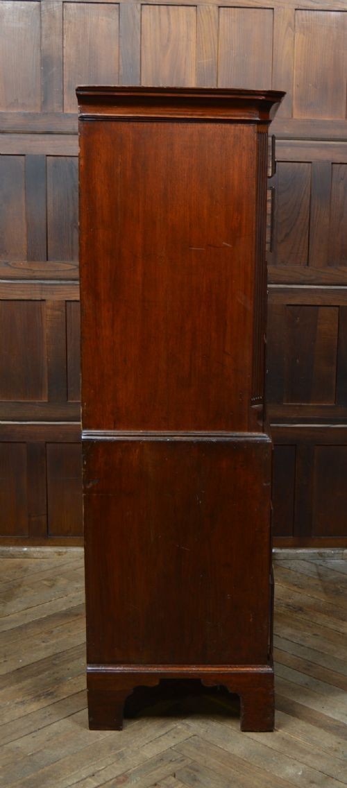 A Georgian mahogany chest-on-chest featuring two stacked drawer units with brass handles and bracket feet. View III