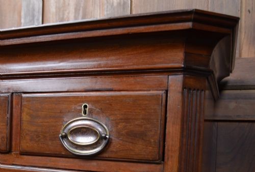A Georgian mahogany chest-on-chest featuring two stacked drawer units with brass handles and bracket feet. View VI