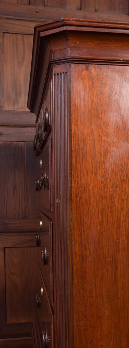 A Georgian mahogany chest-on-chest featuring two stacked drawer units with brass handles and bracket feet. View XII