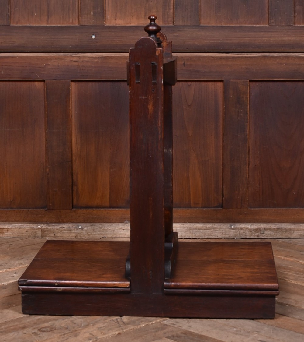A Victorian dark oak wooden book press featuring a large central hand-turned screw mechanism and solid platen shelves. View VIII