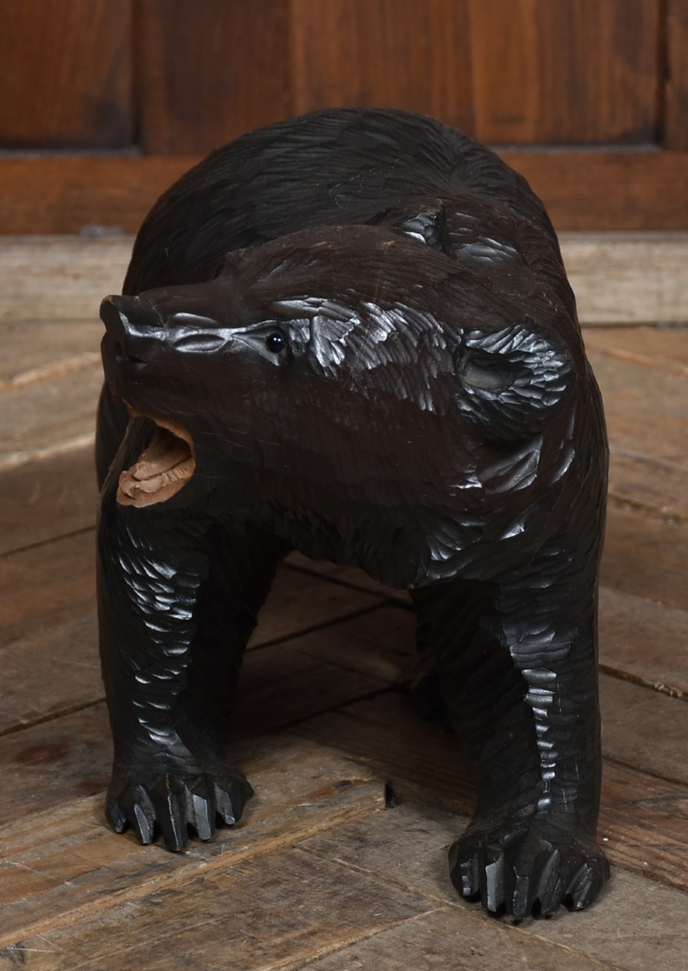 A hand-carved dark wood Japanese Kibori Kuma bear sculpture depicting a standing bear with an open mouth showing carved teeth and textured fur detailing. View V