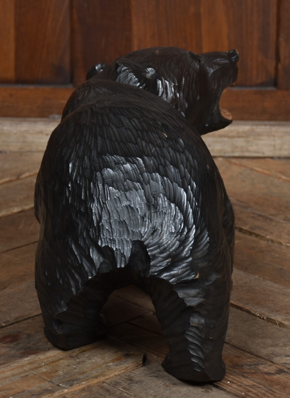 A hand-carved dark wood Japanese Kibori Kuma bear sculpture depicting a standing bear with an open mouth showing carved teeth and textured fur detailing. View VII