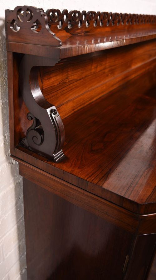 A 19th-century rosewood breakfront side cabinet featuring rich grain panels, carved accents, and a pierced top gallery rail. View III