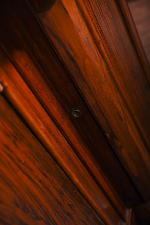 A 19th-century rosewood breakfront side cabinet featuring rich grain panels, carved accents, and a pierced top gallery rail. View V