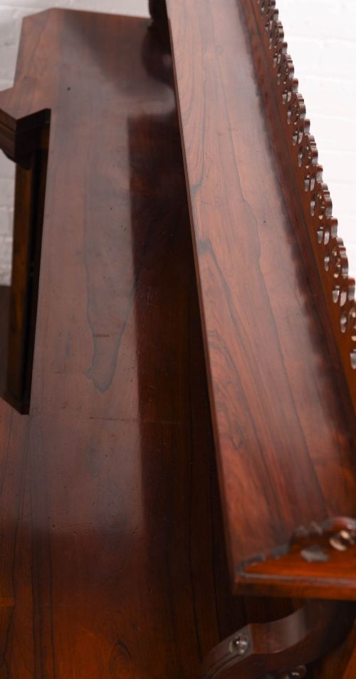A 19th-century rosewood breakfront side cabinet featuring rich grain panels, carved accents, and a pierced top gallery rail. View X