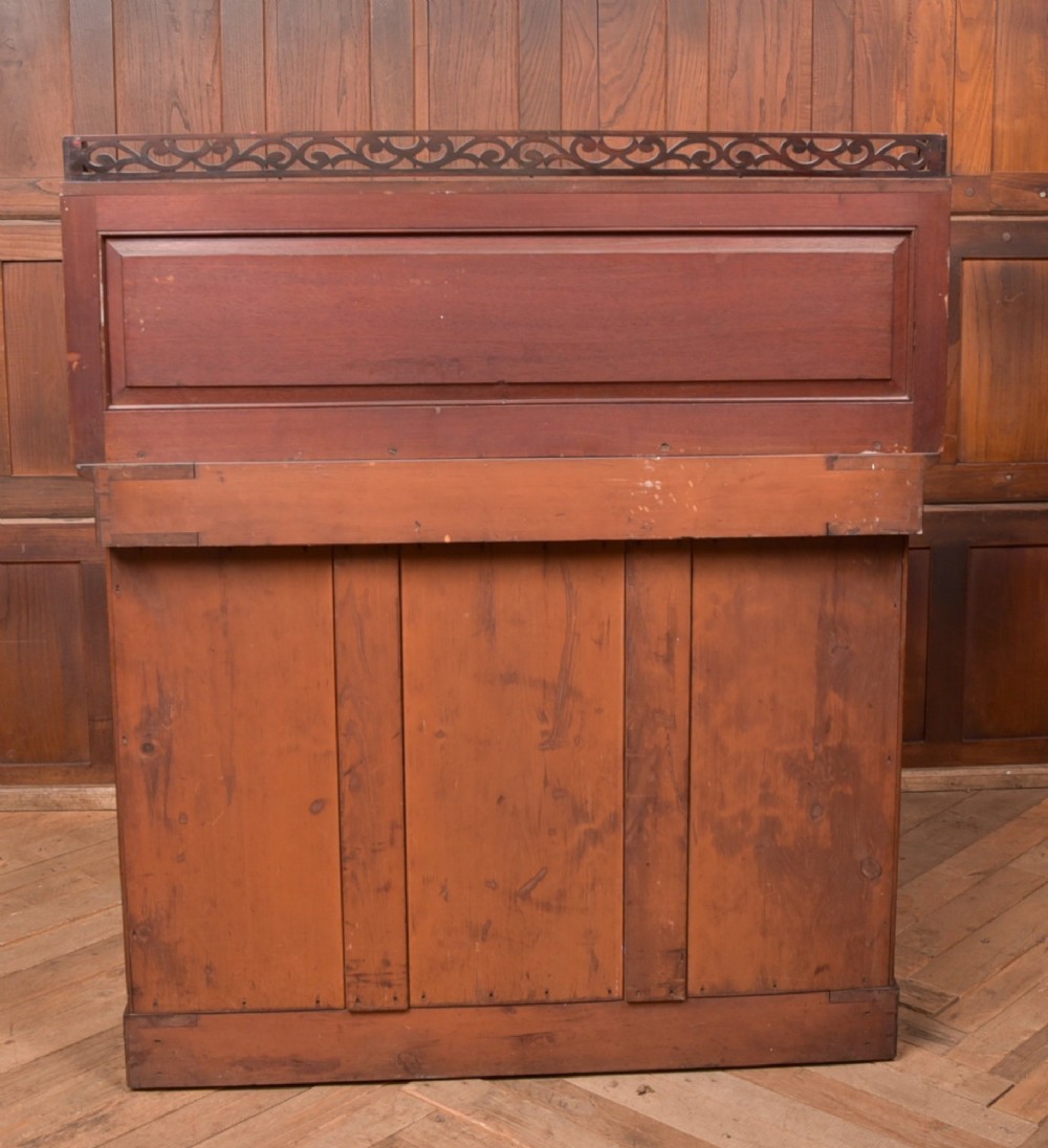 A Victorian rosewood chiffonier side cabinet featuring a raised back shelf with open fretwork gallery, turned columns, and a double-door cupboard base. View IV