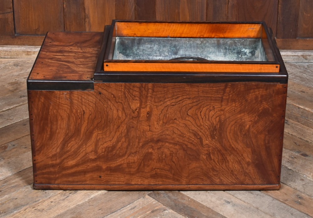 A traditional Japanese wooden hibachi brazier featuring rich figured wood grain, a copper-lined inner well, multiple small drawers, and iron bail handles. View VIII