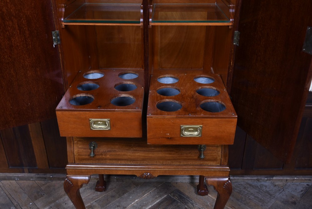 An Edwardian mahogany drinks cabinet on stand featuring chevron-matched wood veneer doors, a lower drawer with brass drop handles, and carved cabriole legs ending in ball and claw feet. View III