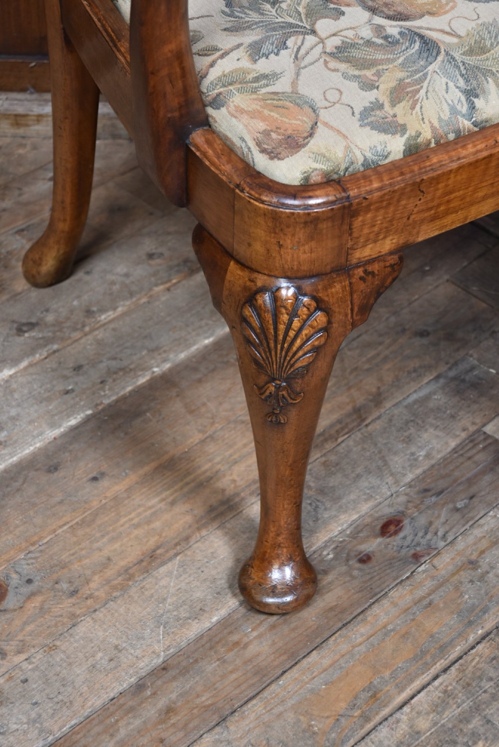 A pair of Victorian Queen Anne style walnut armchairs featuring vase-shaped back splats, carved cabriole legs, and floral patterned drop-in seats. View III
