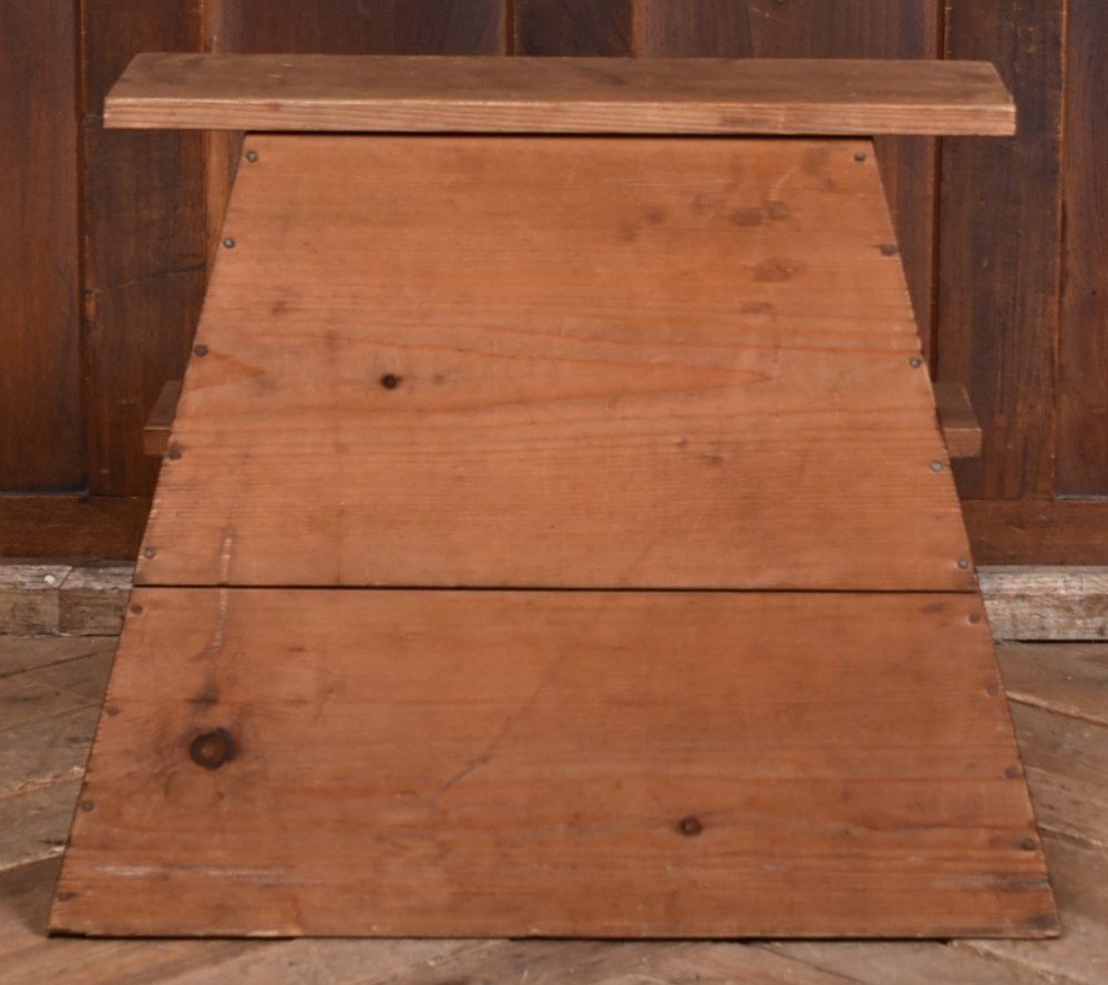 A warm brown wooden Japanese vendor stool featuring a stepped rectangular base, a circular front cutout opening, and a flat upper shelf. View IV