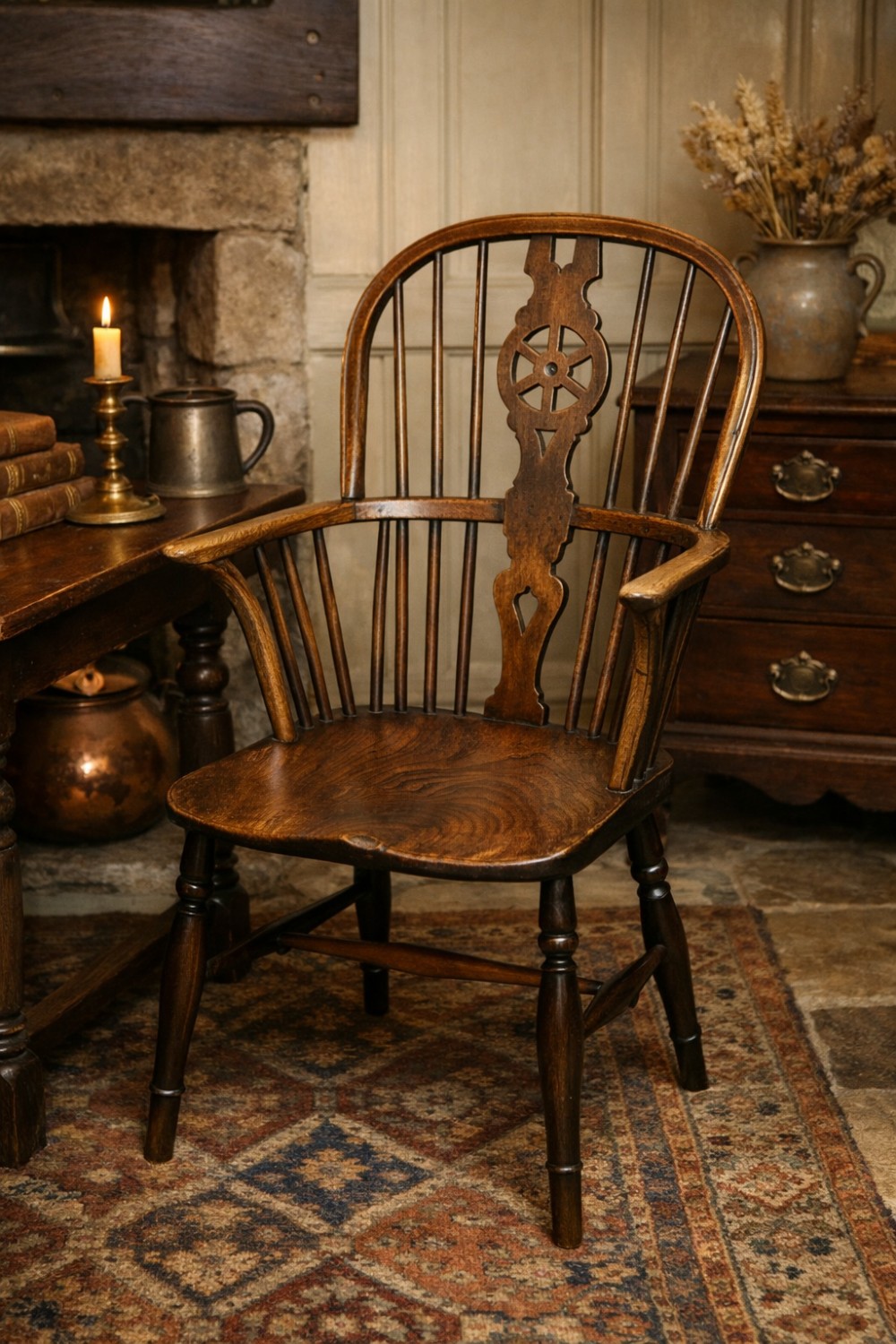 A 19th-century dark wood Windsor armchair featuring a pierced wheel back splat, spindle backrest, curved armrests, shaped seat, and turned legs. View VI