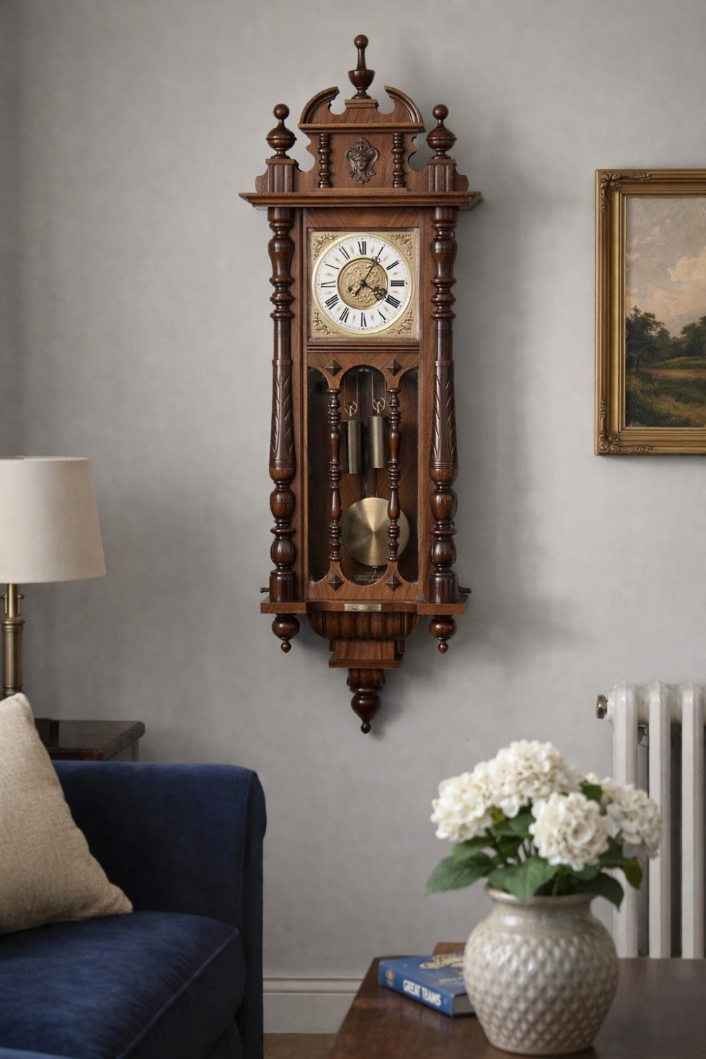 A late 19th-century Vienna-style wall clock featuring a dark walnut carved wood case, turned side columns, decorative pediment, brass weights, and a brass pendulum. View IX