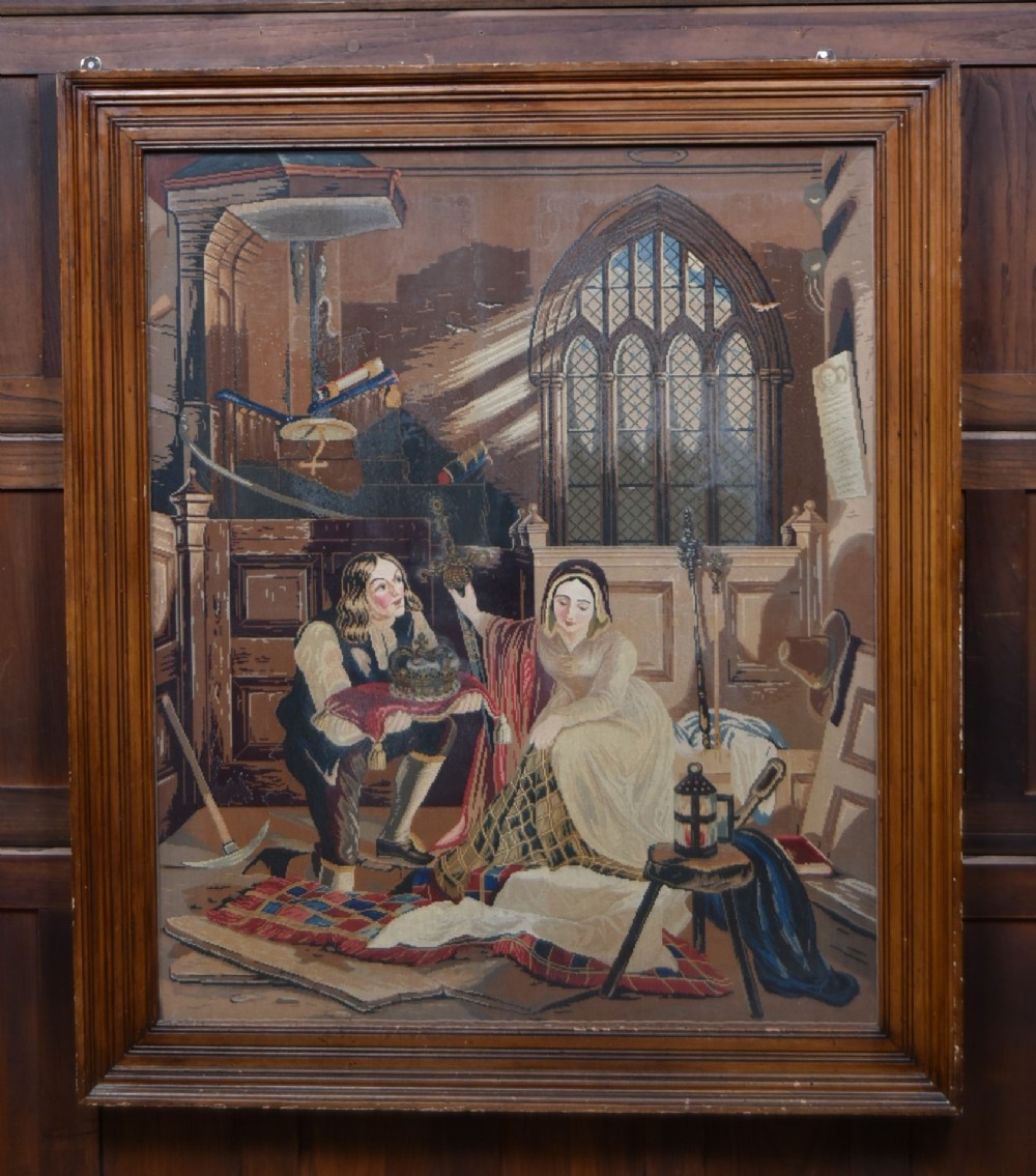 A framed needlepoint tapestry depicting figures and a crown inside an ecclesiastical interior with light streaming through a Gothic window.