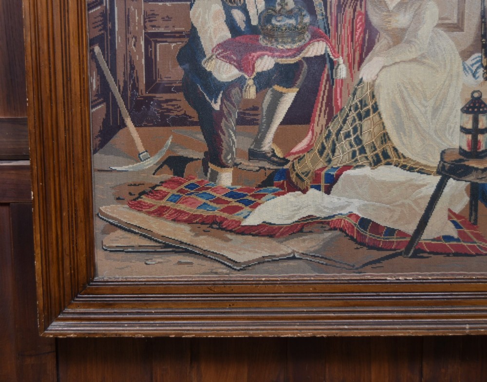 A framed needlepoint tapestry depicting figures and a crown inside an ecclesiastical interior with light streaming through a Gothic window. View VI