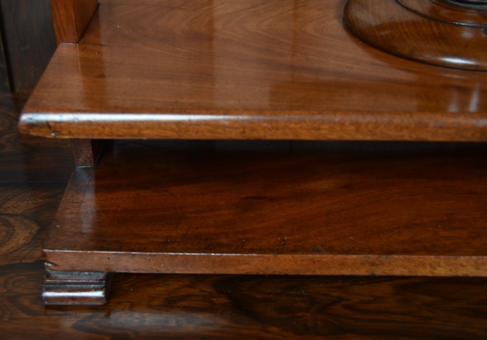 A Victorian mahogany tabletop book press featuring a wooden central screw thread, turned crossbar handles, and a polished base. View III
