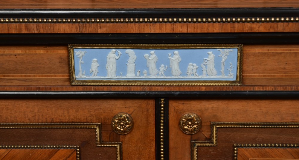 A Victorian inlaid rosewood credenza sideboard featuring central parquetry doors adorned with blue jasperware plaques, flanked by two glass-fronted side display cabinets. View II