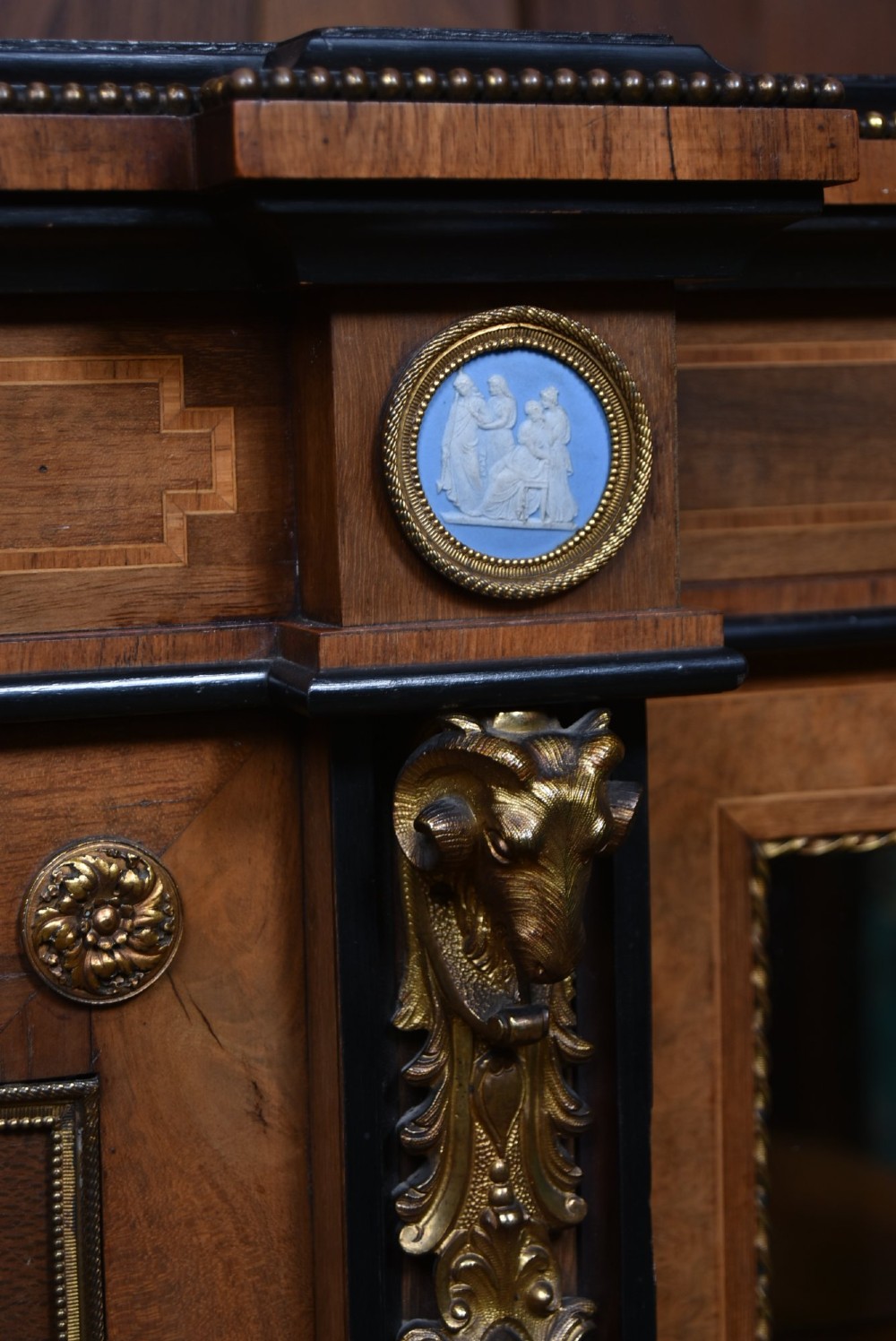 A Victorian inlaid rosewood credenza sideboard featuring central parquetry doors adorned with blue jasperware plaques, flanked by two glass-fronted side display cabinets. View VI