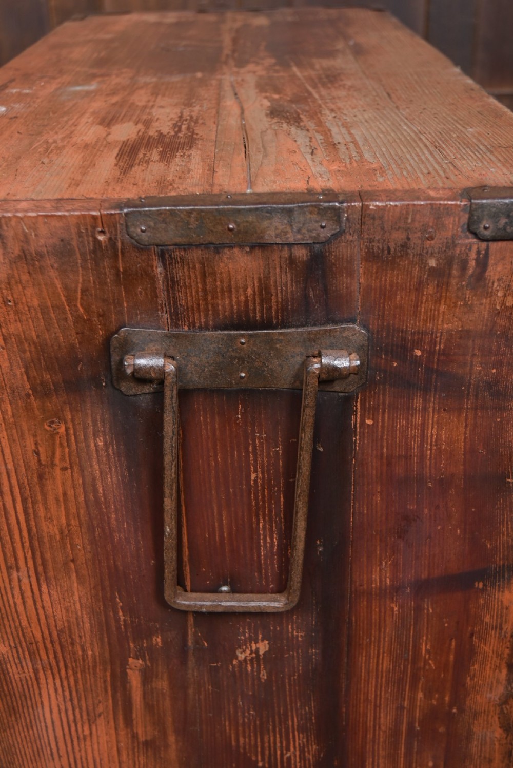 A Japanese tansu wooden chest featuring multiple drawers, sliding louvered doors, a small lockable door, and dark iron corner plates and drop handles. View X