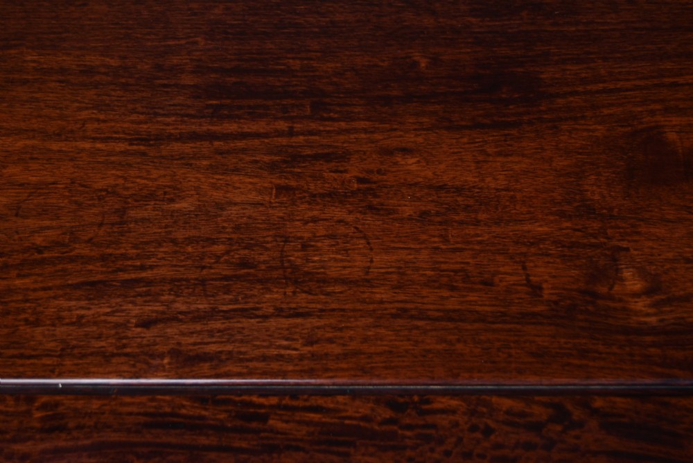 A low square Chinese padouk coffee table featuring a floating panel top, simple waist frame, and square legs terminating in horse-hoof feet. View VI