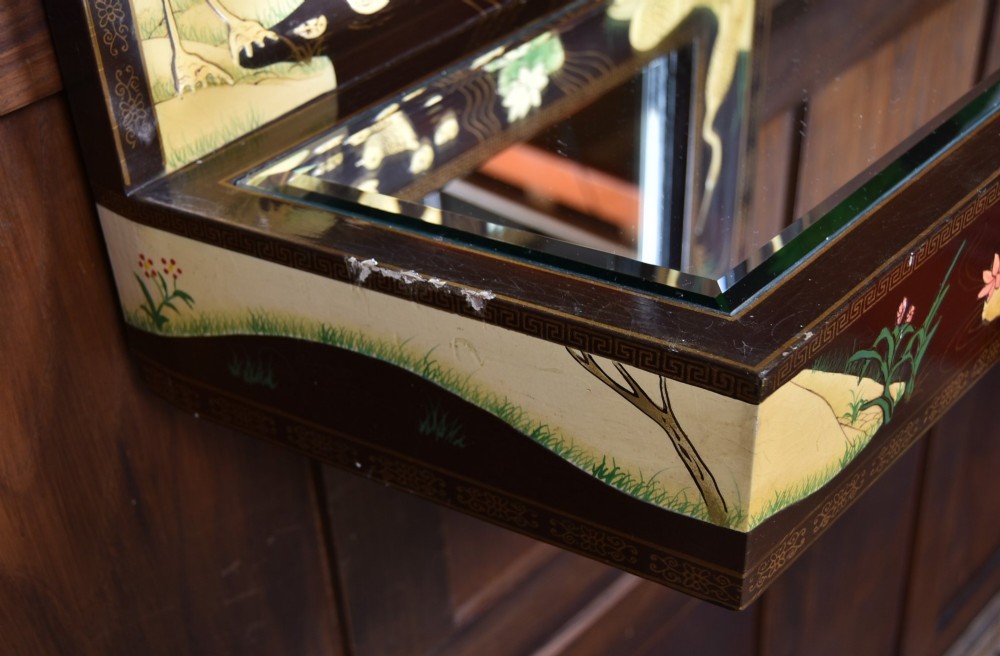 A tall black lacquered rectangular wall mirror featuring an integrated bottom shelf and painted borders with cranes, lotus blossoms, and botanical details. View IX