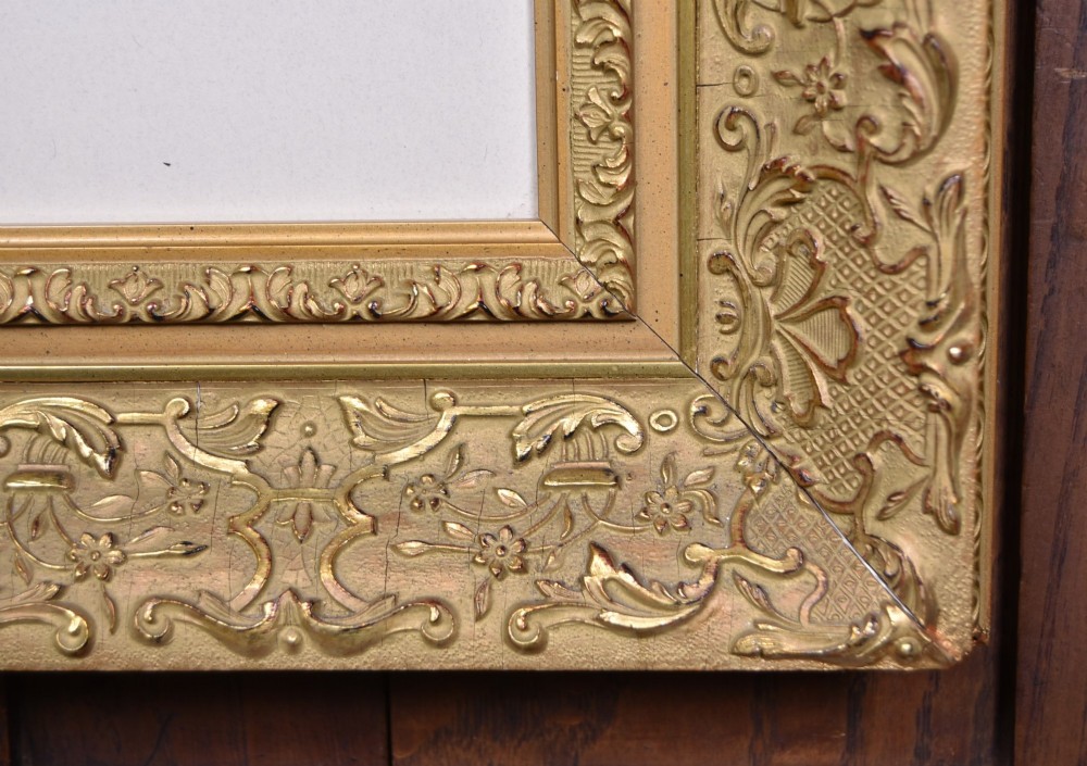 A framed monochrome print depicting a young violinist in period costume, set within a cream mount and an ornate gilded frame. View VIII