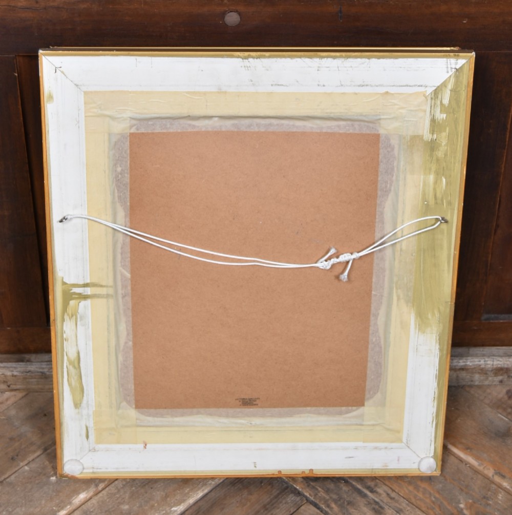 A framed monochrome print depicting a young violinist in period costume, set within a cream mount and an ornate gilded frame. View X