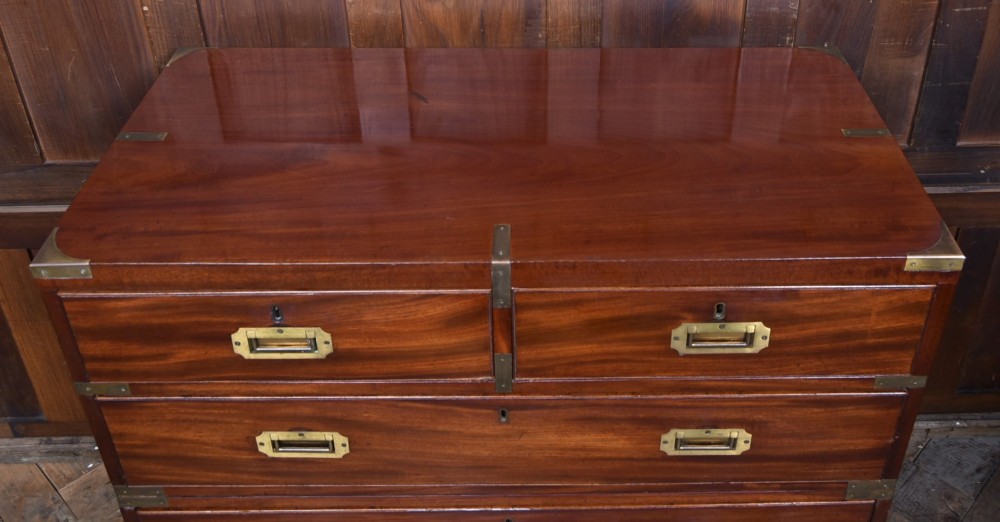 A 19th-century mahogany campaign chest of drawers featuring flush brass handles, corner brackets, and a two-section design. View III