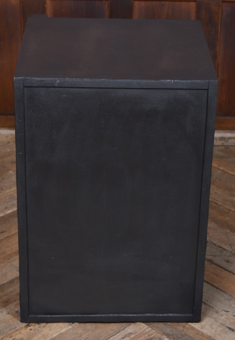 A heavy black painted iron safe featuring a rectangular body, a brass maker plaque for James Bruce of Glasgow, a faceted brass handle, and a brass fire-resisting emblem. View XII