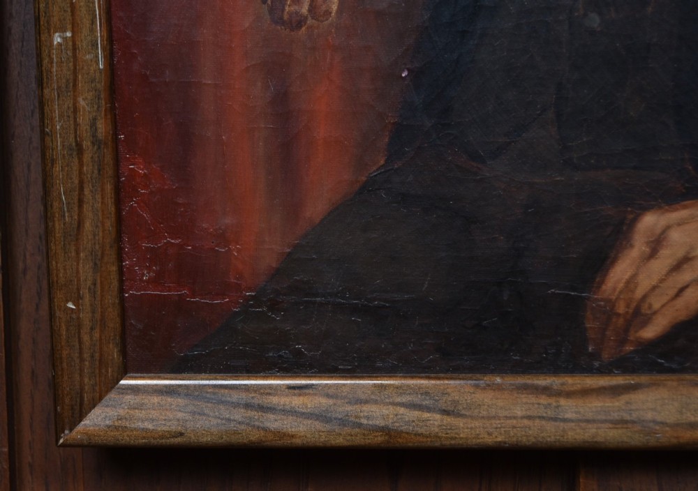 A nineteenth-century oil painting depicting a seated gentleman with sideburns wearing a black coat, framed in a simple dark wooden border. View V