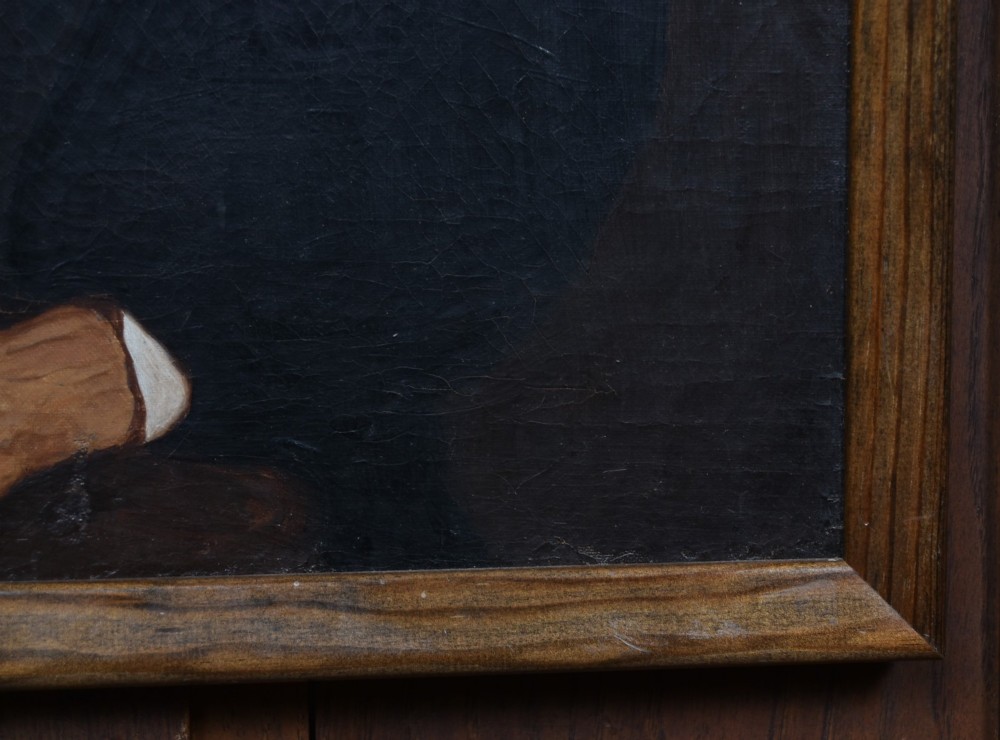A nineteenth-century oil painting depicting a seated gentleman with sideburns wearing a black coat, framed in a simple dark wooden border. View VI