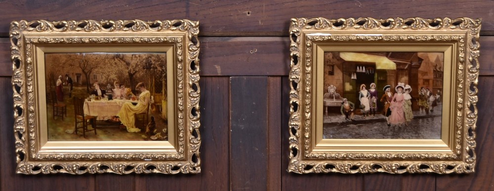 A pair of 19th-century framed crystoleum prints depicting figurative genre scenes, set inside deeply carved gilt frames.