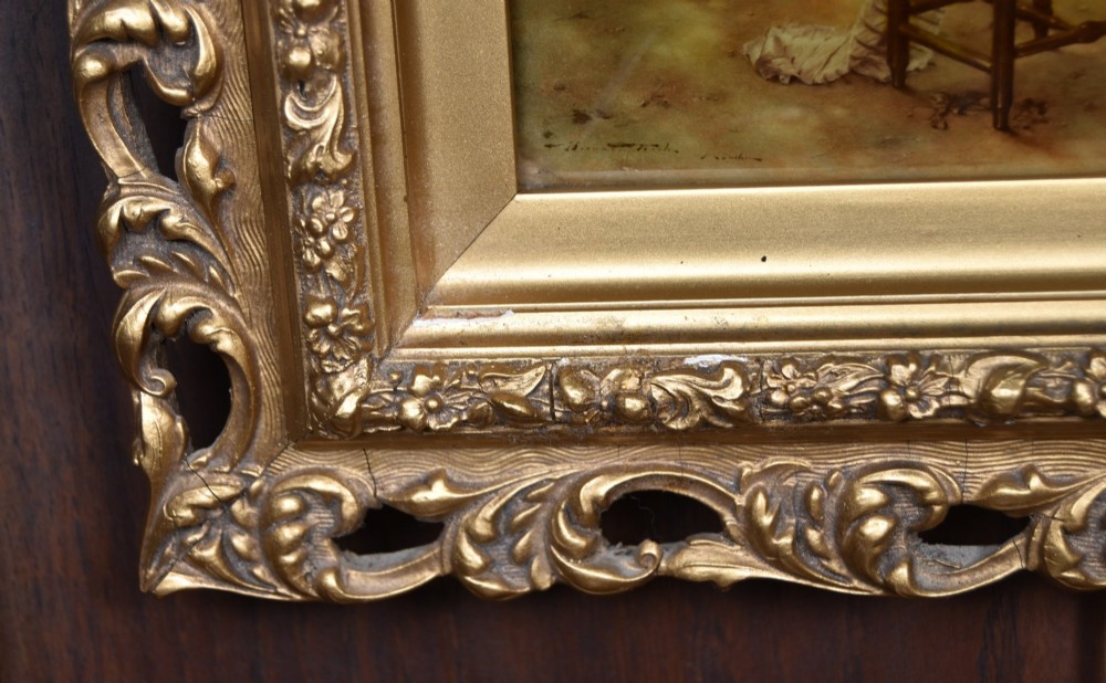 A pair of 19th-century framed crystoleum prints depicting figurative genre scenes, set inside deeply carved gilt frames. View V