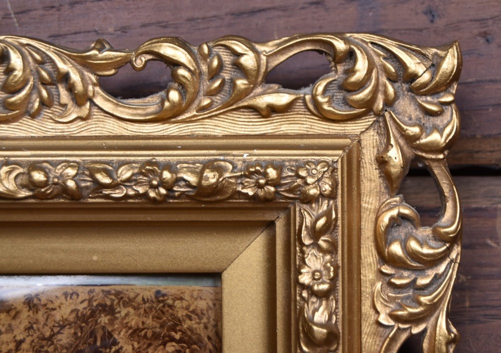 A pair of 19th-century framed crystoleum prints depicting figurative genre scenes, set inside deeply carved gilt frames. View VII