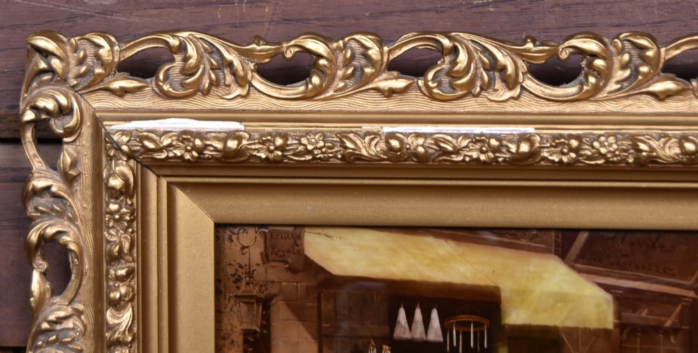 A pair of 19th-century framed crystoleum prints depicting figurative genre scenes, set inside deeply carved gilt frames. View X
