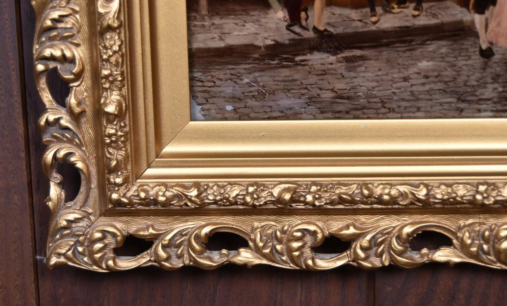 A pair of 19th-century framed crystoleum prints depicting figurative genre scenes, set inside deeply carved gilt frames. View XV