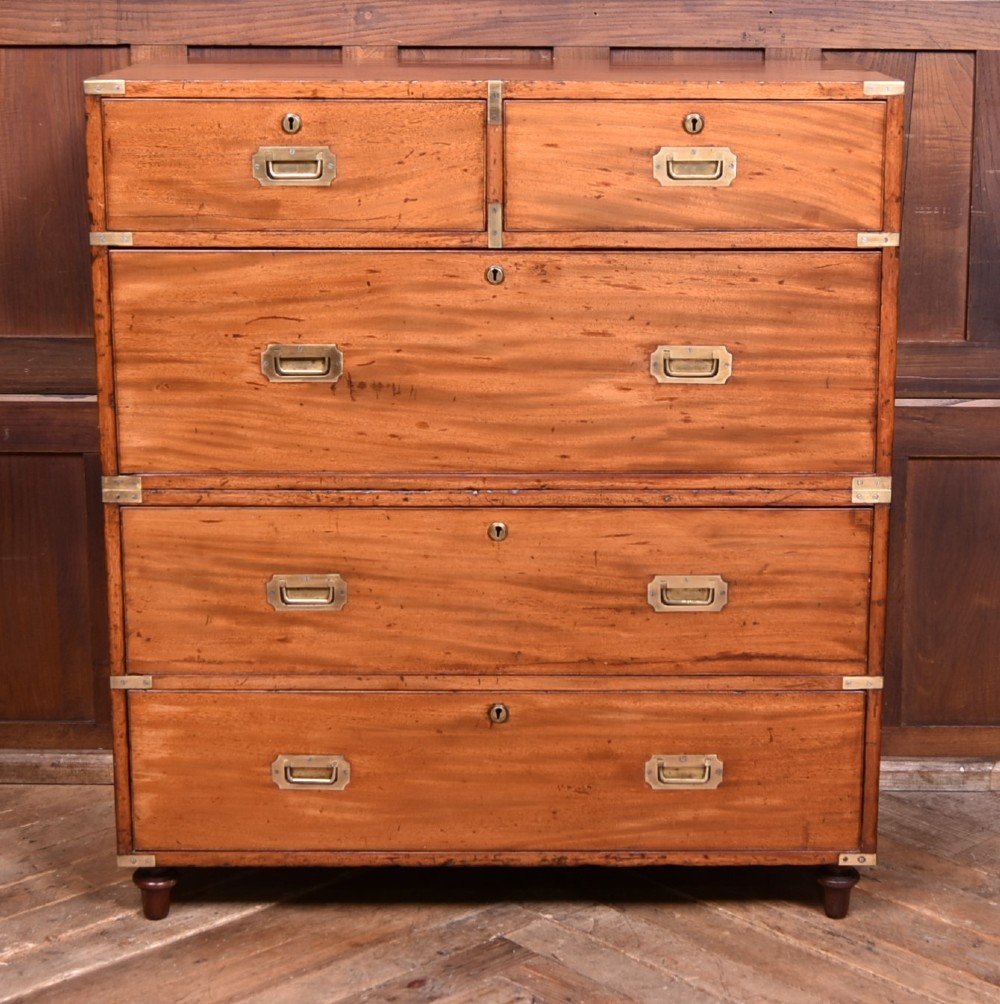 A 19th-century mahogany campaign chest of drawers with two short over three long drawers, featuring inset brass handles and brass corner straps. View II