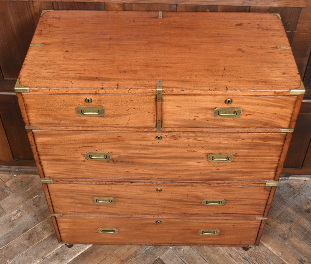 A 19th-century mahogany campaign chest of drawers with two short over three long drawers, featuring inset brass handles and brass corner straps. View III
