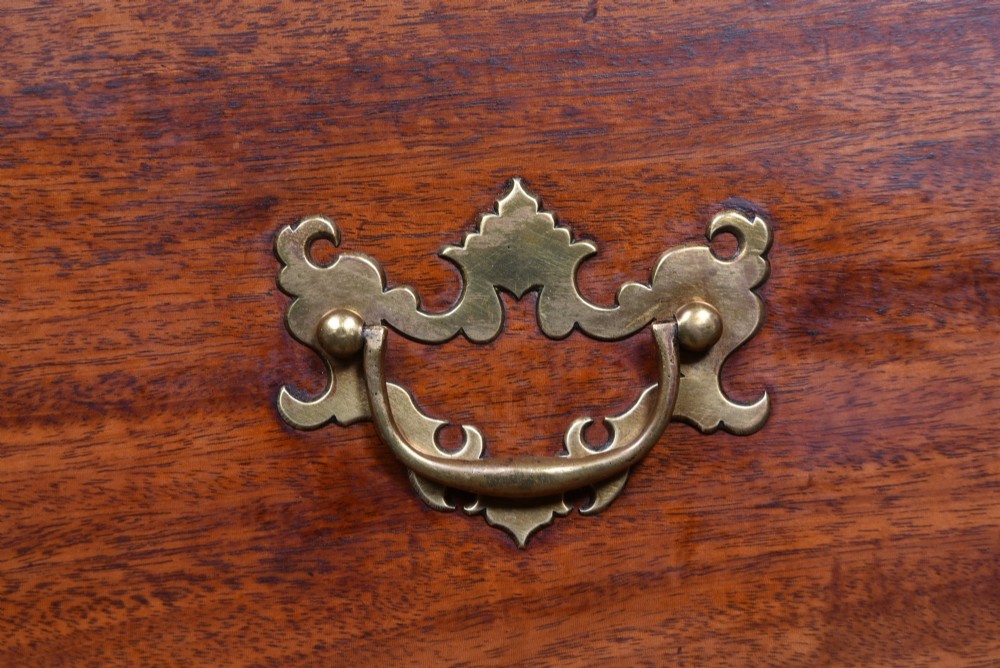 A tall Georgian mahogany chest on chest featuring two stacked tiers of drawers with brass swan-neck handles resting on bracket feet. View IV