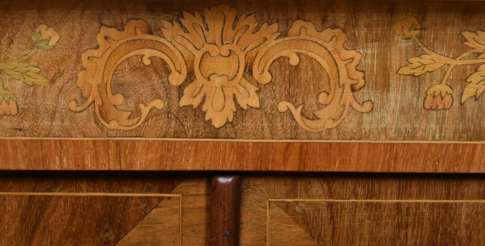 A Victorian walnut pier cabinet featuring double glazed arched doors, floral marquetry inlay, and decorative ormolu mounts. View III