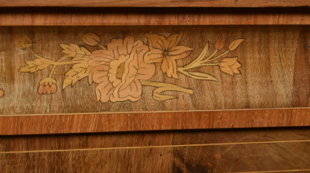 A Victorian walnut pier cabinet featuring double glazed arched doors, floral marquetry inlay, and decorative ormolu mounts. View IV