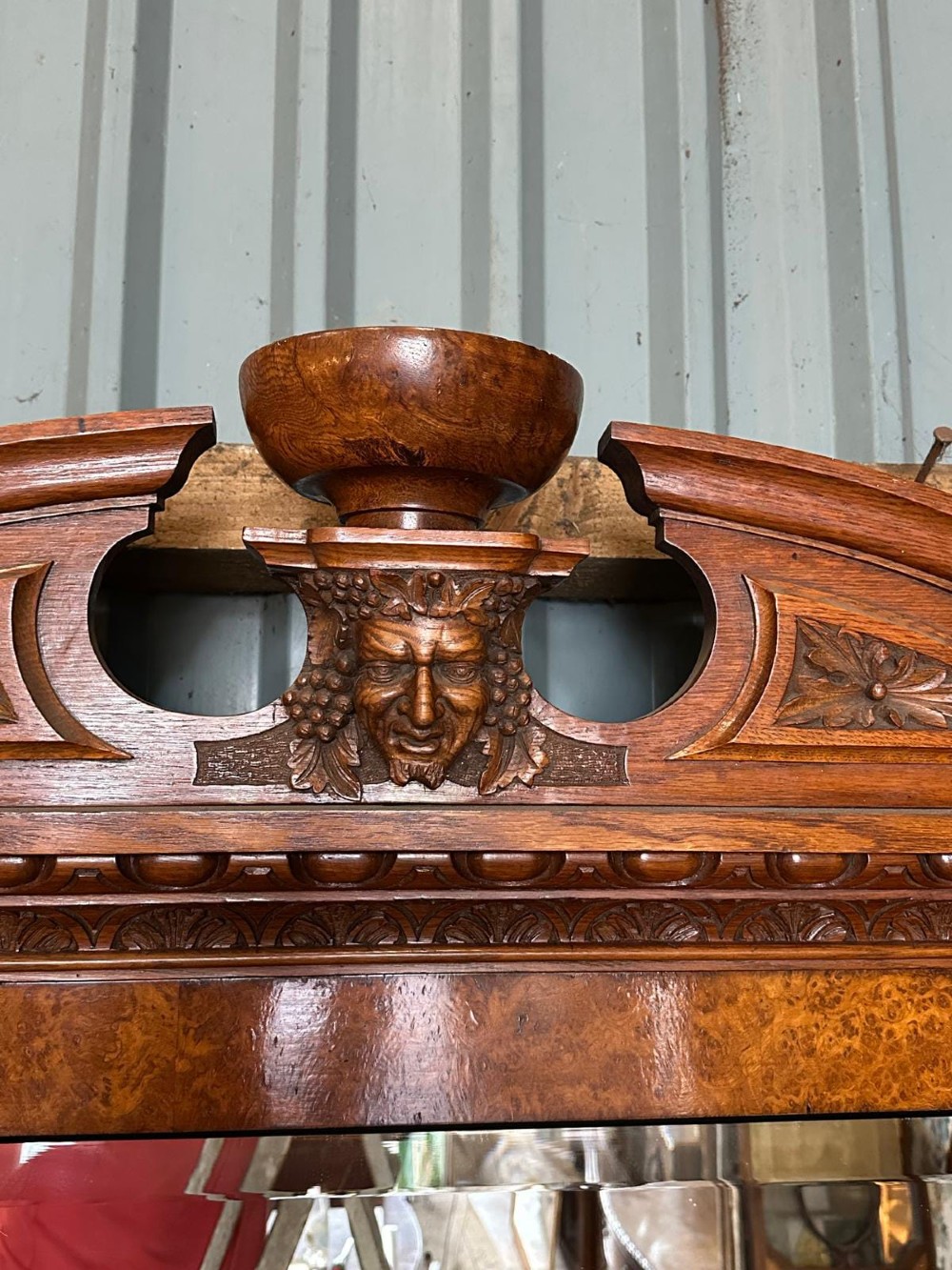 A large Victorian pollard oak mirror-back sideboard featuring carved urn finials, central mirror glass, open side shelving, and ebonised drawer borders. View IV