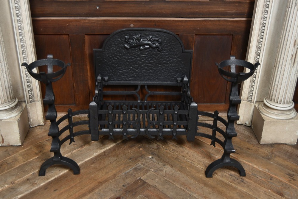 An off-white painted Neoclassical fireplace surround featuring fluted columns and swags, paired with a black cast iron fire grate. View VI