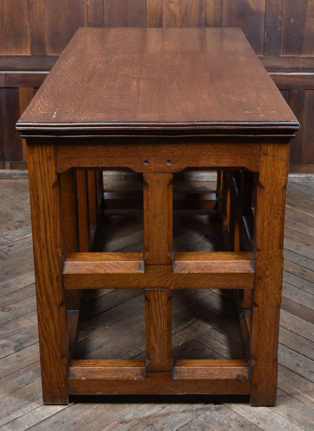 A Victorian oak church communion table with carved Gothic arch panels and a carved inscription reading Do this in Remembrance of me along the top frieze. View IX