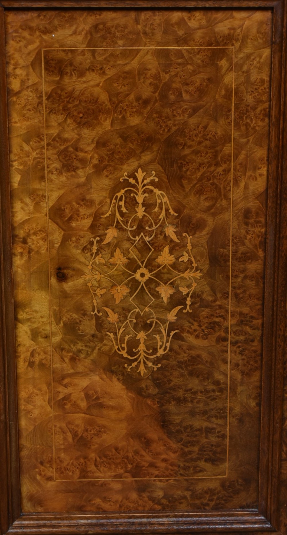 A matching pair of Edwardian burr walnut bedside pot cupboards featuring central marquetry inlays, single doors, glass tops, and plinth bases. View III