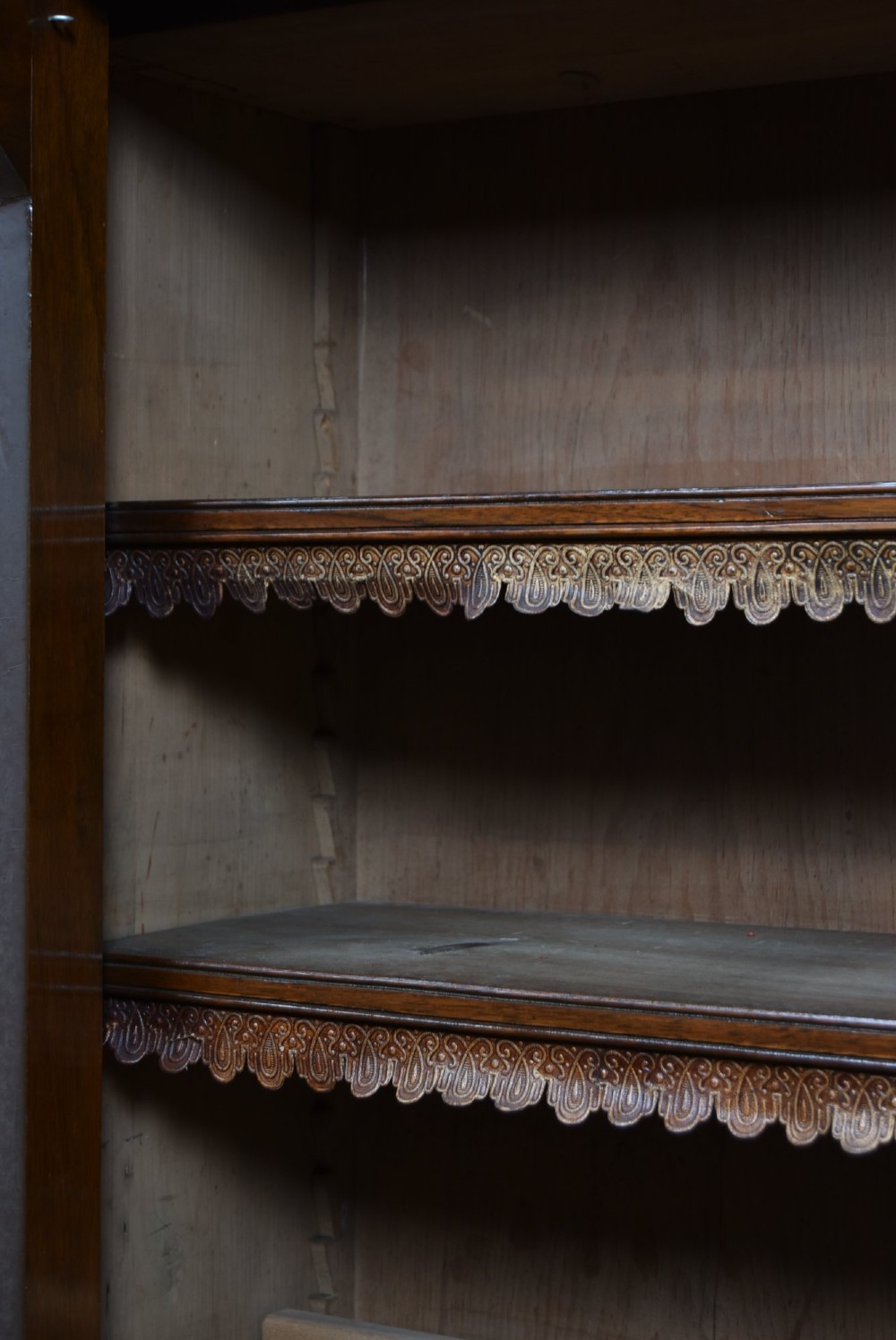 An Edwardian walnut glazed bookcase featuring a two-door upper section with glass panels, adjustable interior shelving, and a lower cabinet with burr walnut door panels. View VII