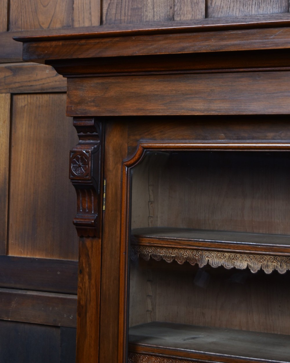 An Edwardian walnut glazed bookcase featuring a two-door upper section with glass panels, adjustable interior shelving, and a lower cabinet with burr walnut door panels. View XII