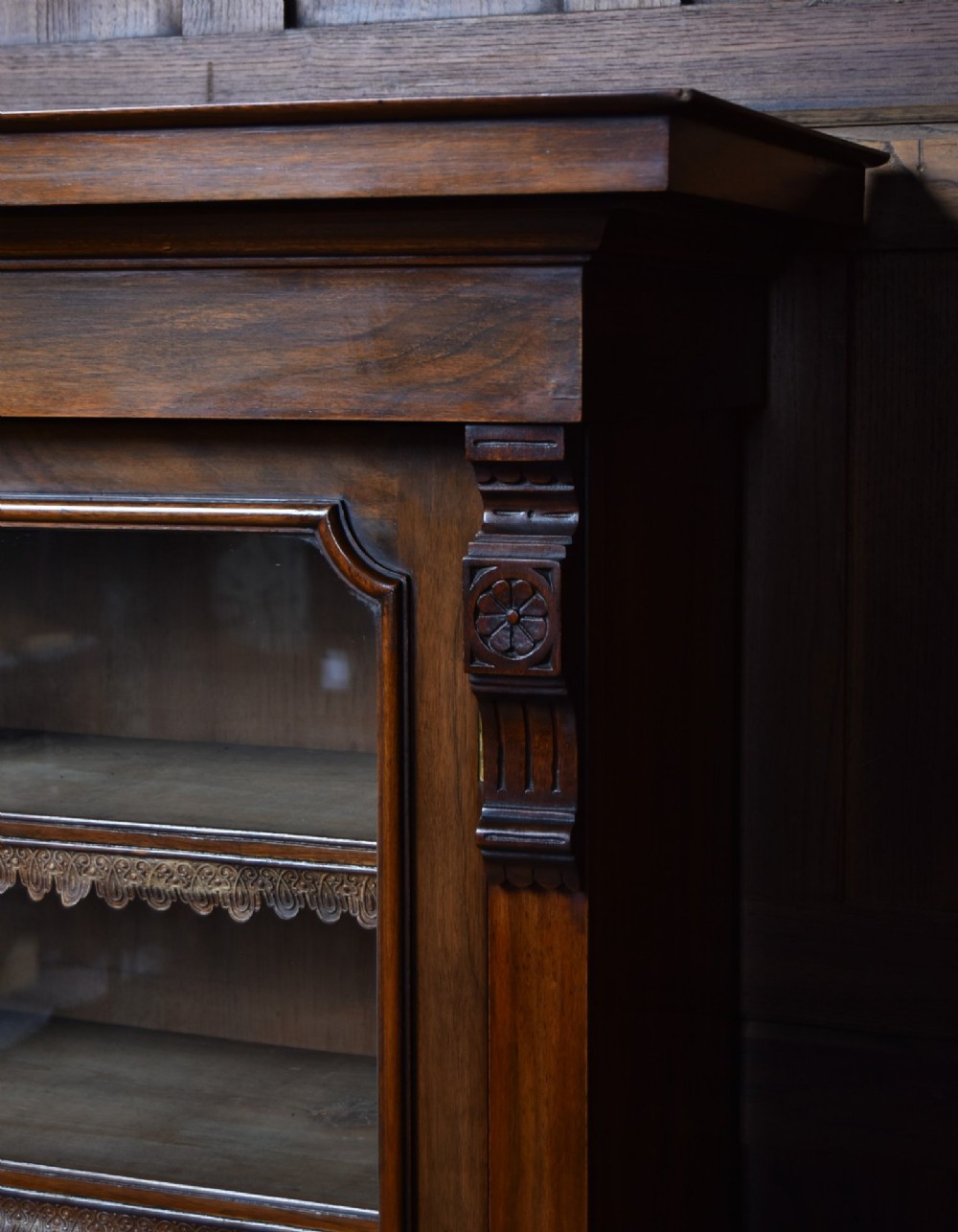 An Edwardian walnut glazed bookcase featuring a two-door upper section with glass panels, adjustable interior shelving, and a lower cabinet with burr walnut door panels. View XIII